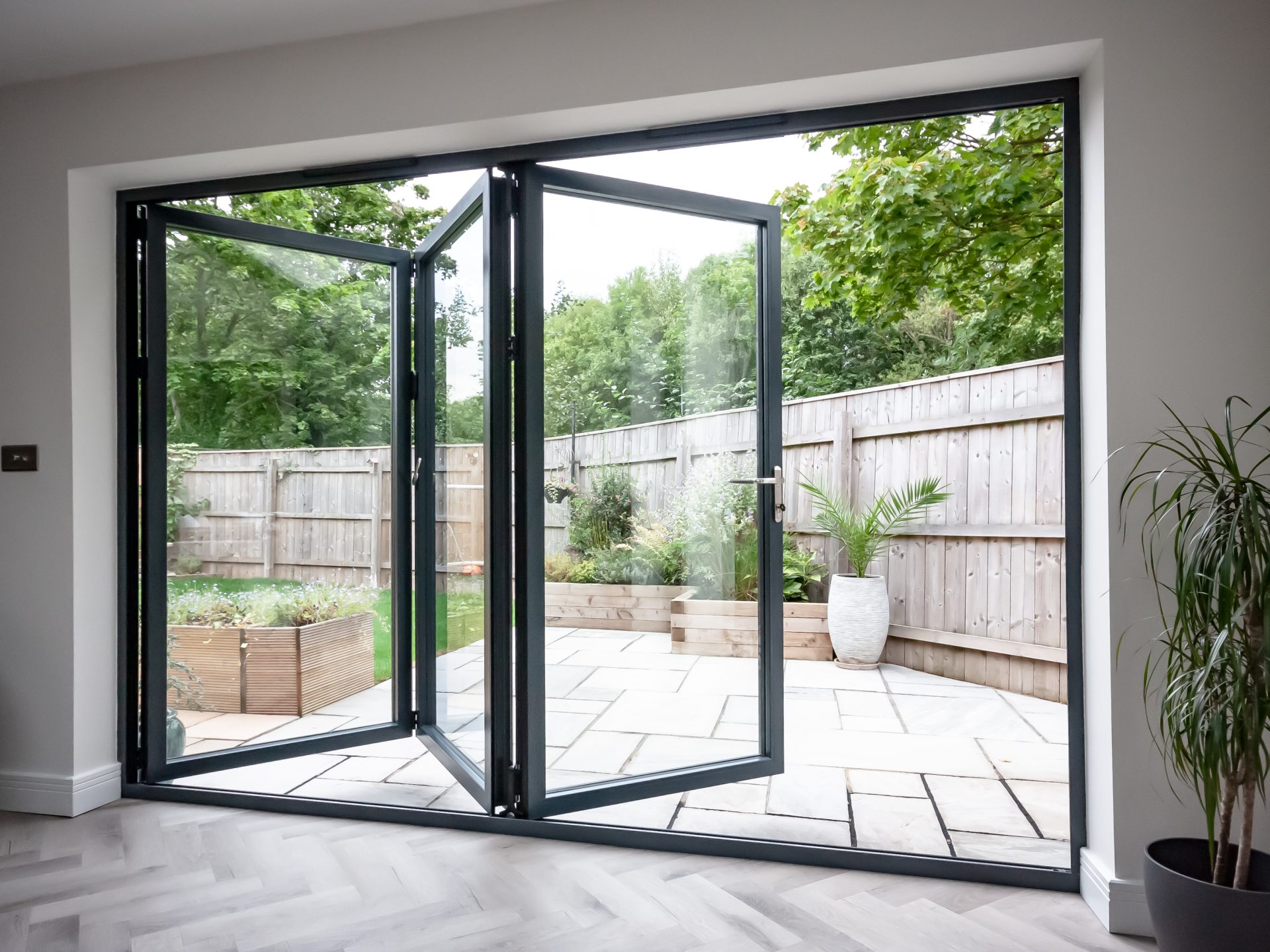Bifold doors with a garden view for a home in Wiltshire
