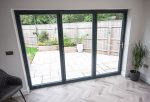 Grey aluminium bifold doors for a home in Swindon.